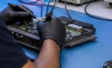Probe tips on the board of an opened control module